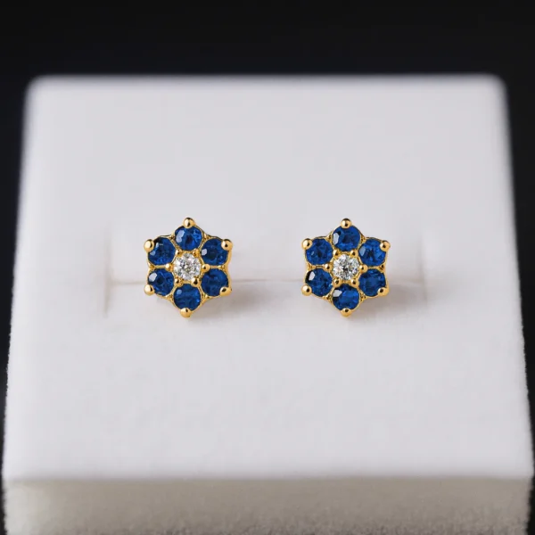 9kt Gold Blue Floral Earstuds. Lightweight, comfortable, and suitable for multiple piercings. Everyday luxury from Cha Cha Jewellers, Bradford.