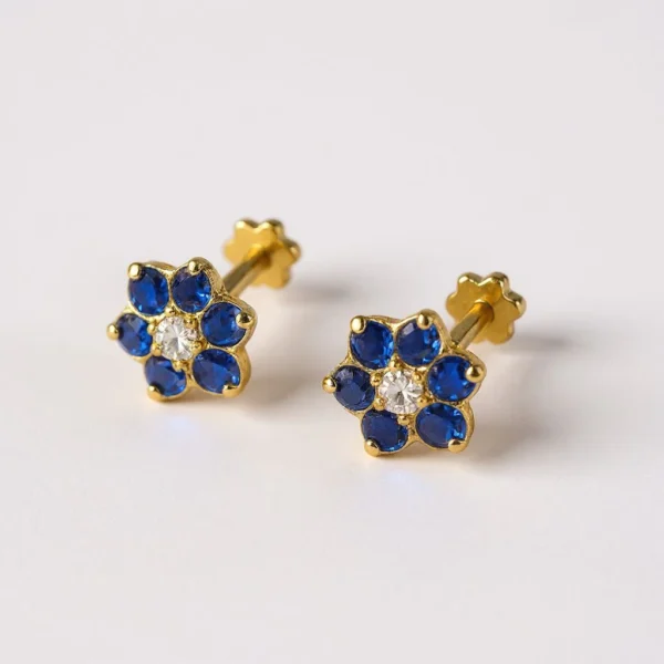 9kt Gold Blue Floral Earstuds. Lightweight, comfortable, and suitable for multiple piercings. Everyday luxury from Cha Cha Jewellers, Bradford.
